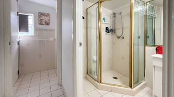 Shower, hair dryer, towels, soap