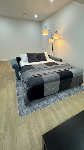 1 bedroom, desk, iron/ironing board, travel crib