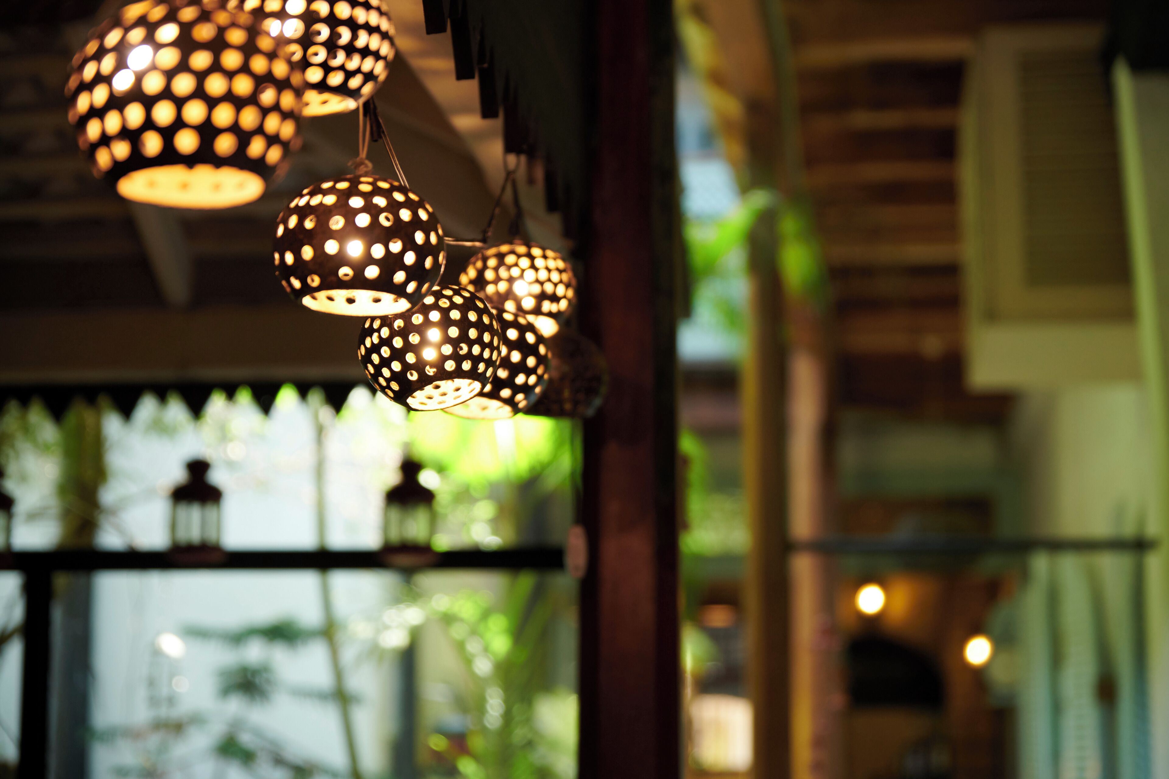 A series of spherical, patterned hanging lights.