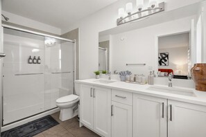 Master bathroom featuring dual sink vanity and large walk-in shower - Mountain views, 2 king beds, garage, 1 hr to Banff (Cochrane)