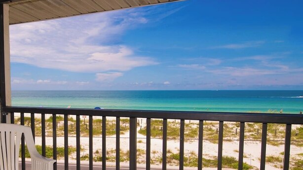 A balcony with a view of the ocean and beach. - AMI Bridgeport 202 -Beach View Retreat+Resort Pool (Bradenton Beach)