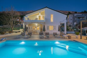 A two-story house with a swimming pool in the foreground. - Family Holiday Home in Tugare With Pool (Omis)