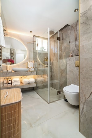 Shower, hair dryer, towels, soap