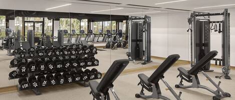 Train with free weights and benches in a polished fitness zone.