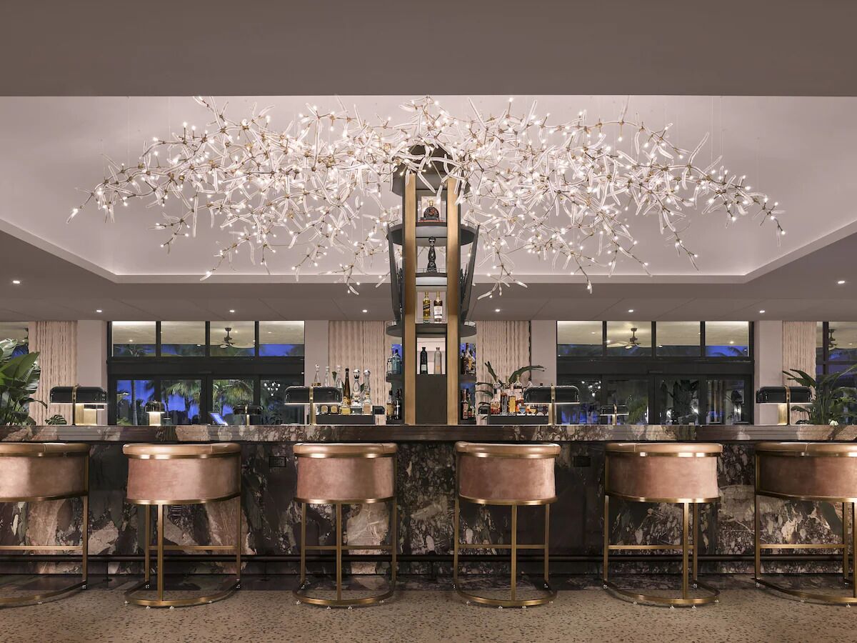 Toast evenings under twinkling lights at the marble bar.