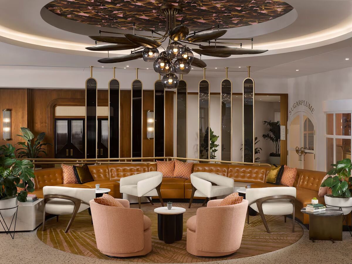 Settle into plush seating under dramatic statement lighting overhead.