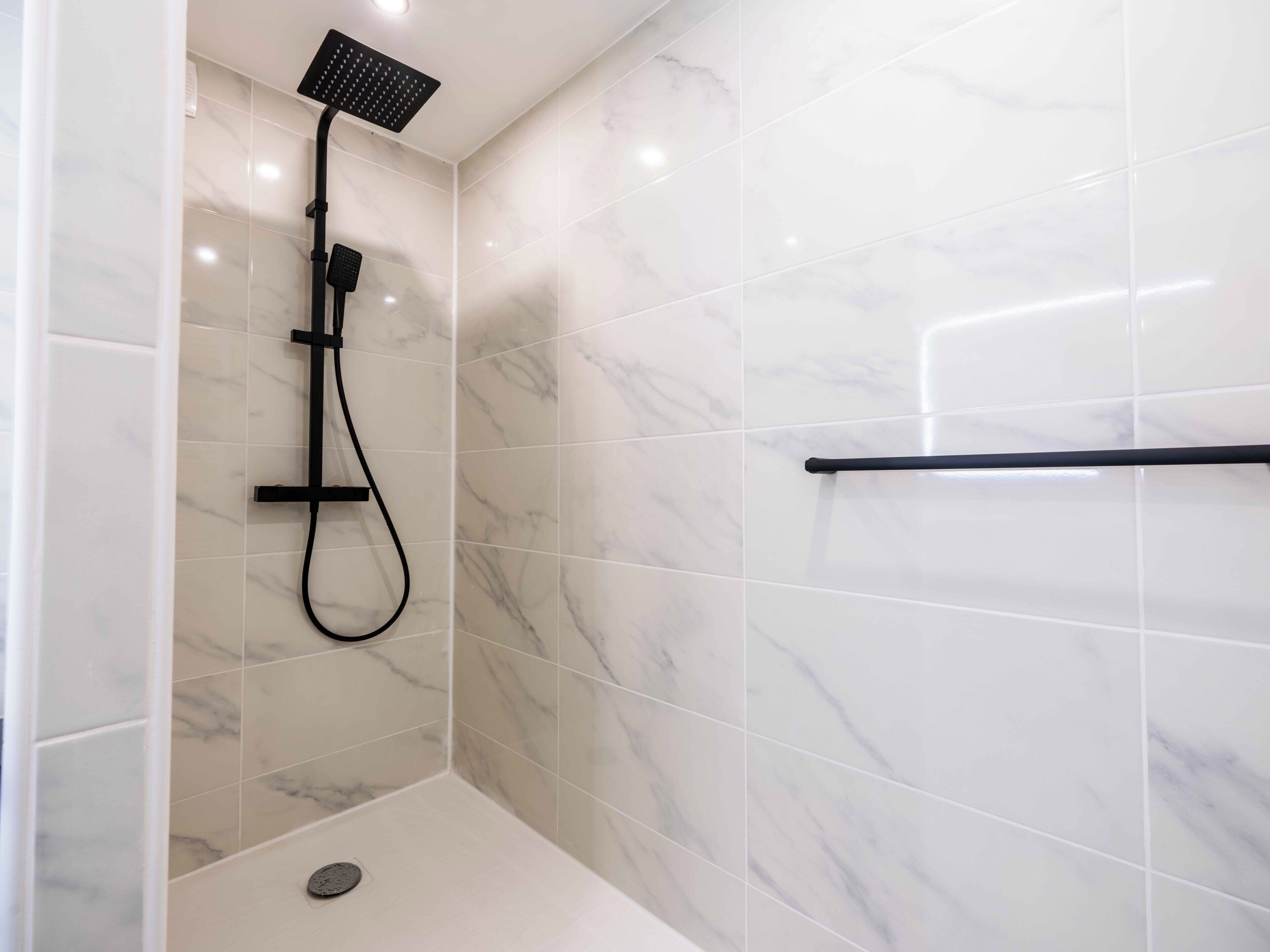Shower, hair dryer, towels, shampoo