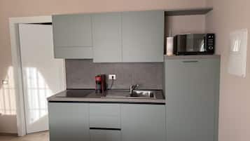 Fridge, microwave, stovetop, coffee/tea maker