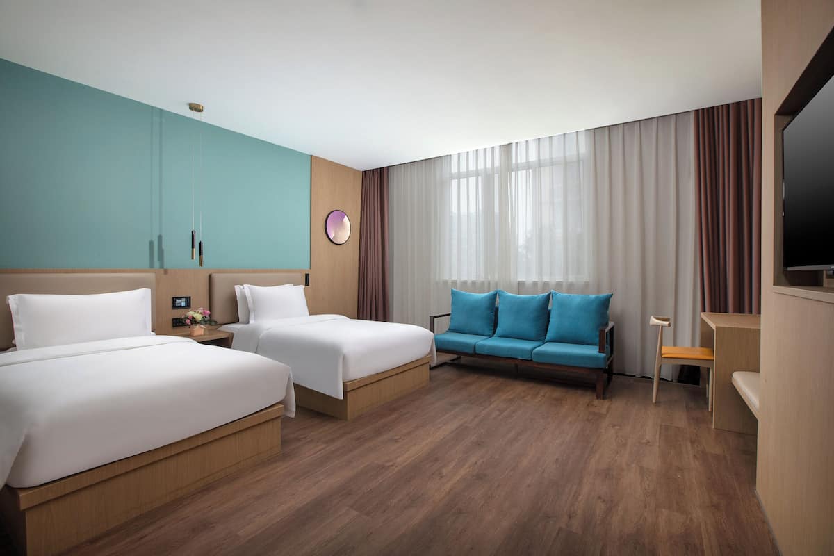 Family Room | Desk, laptop workspace, blackout curtains, iron/ironing board