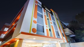 A modern building with a sign reading 'TOWNHOUSE.' - Townhouse Oak Sector 18 Metro Station (Noida)