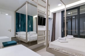 A modern hotel room with a bed, a desk, and a TV. - Grand Party Villa Near Imotski With Jacuzzi (Imotski)