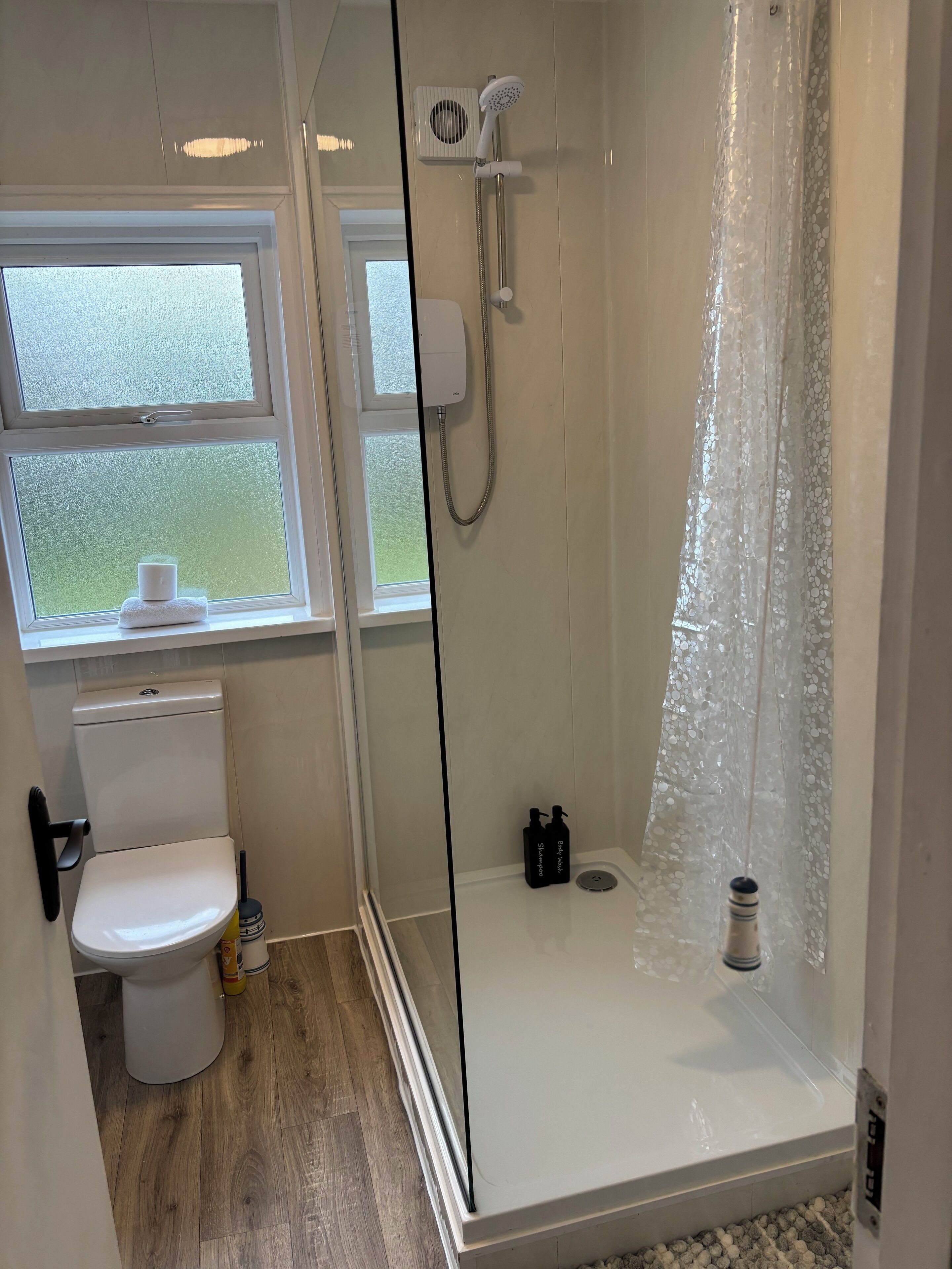 Shower, hair dryer, towels, soap