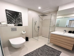A modern bathroom with a toilet, shower, and vanity. - Omis Seaside Retreat for Family (Imotski)