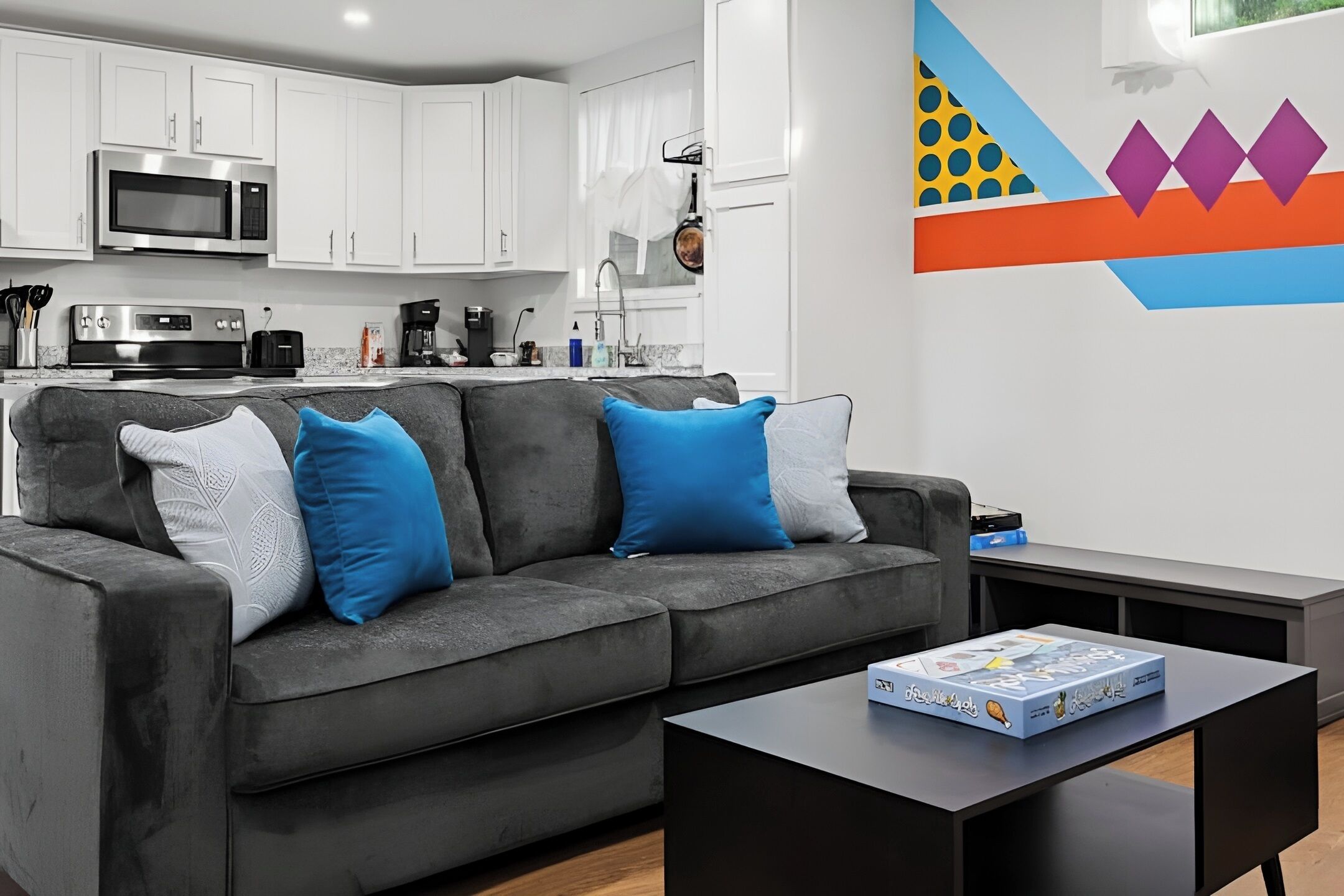 Kick back and relax on the cozy sofa in this bright and modern living room.