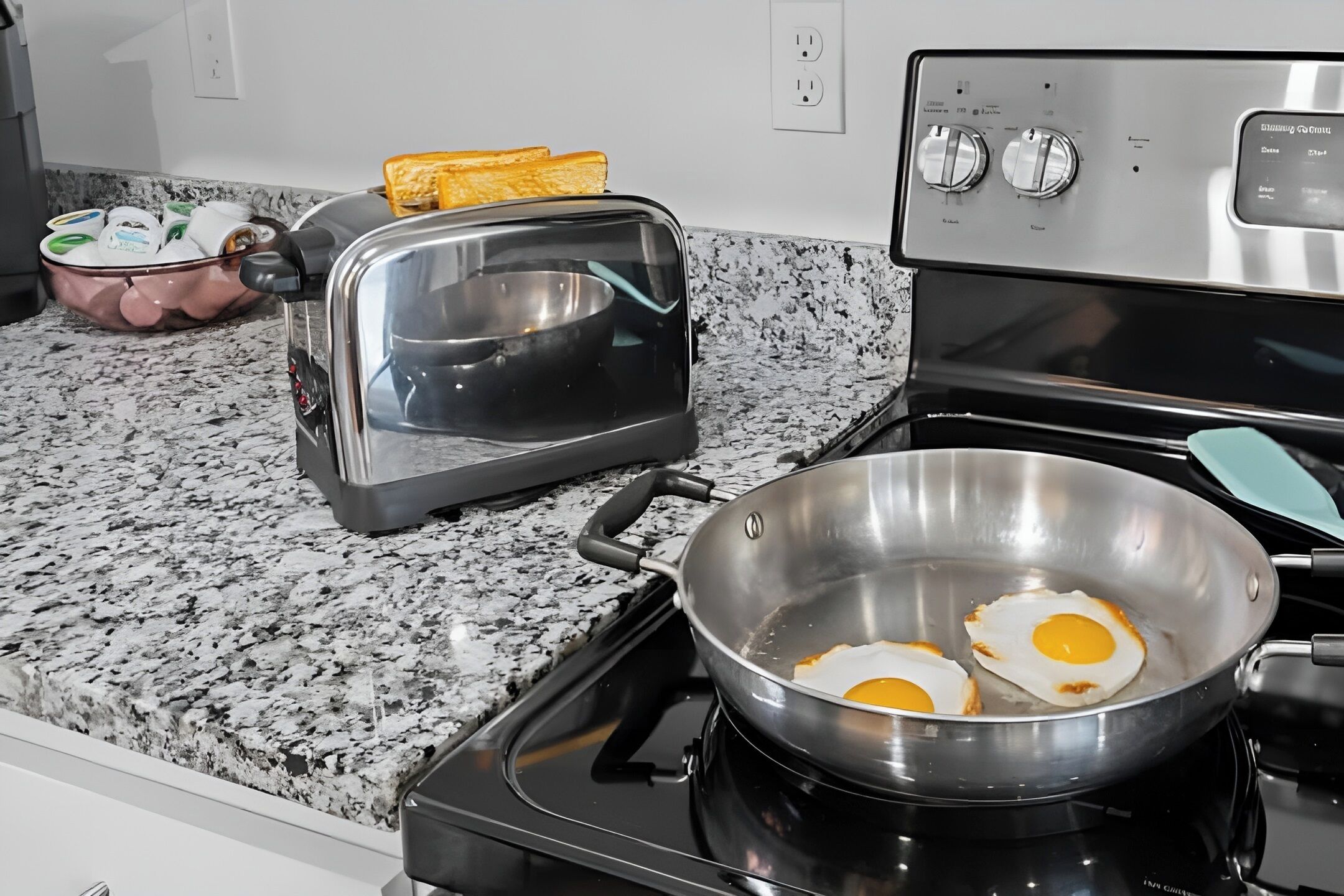 Granite countertops and cookware provided for easy meal prep.