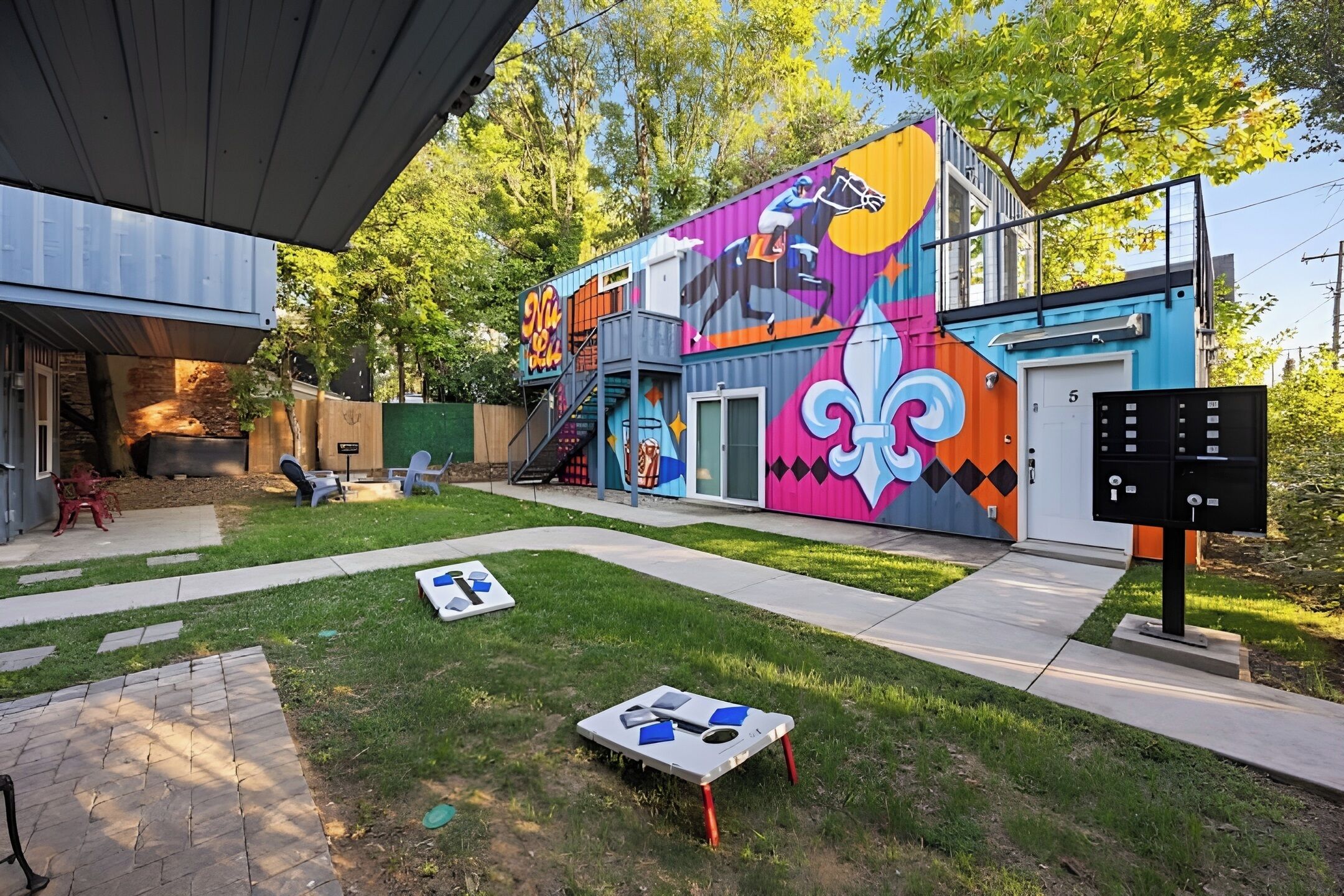 Challenge your friends to a game of cornhole in our vibrant and spacious shared backyard.