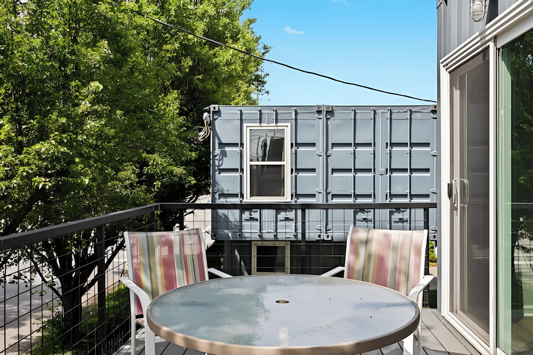 Experience the cool industrial look of shipping container living.