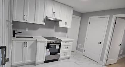 Walk to the Falls! 2BR Modern Home Base + Free Parking & Laundry