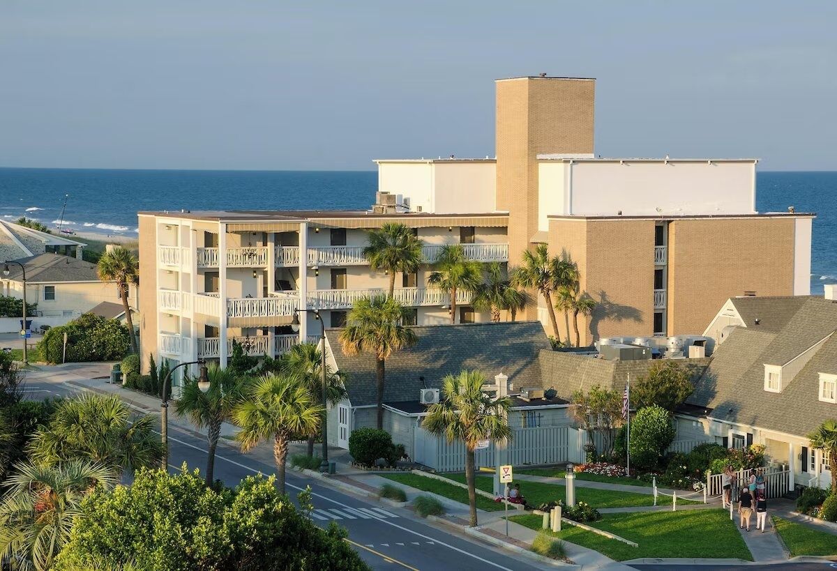 Arrive to breezy seaside charm steps from the shore.