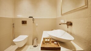 A modern bathroom with a freestanding toilet, a vessel sink, and a shower. - SADRI HAVELI Boutique Heritage Hotel - Lake Pichola Udaipur (Udaipur)