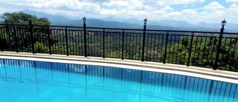 Outdoor pool, open 8:00 AM to 8:00 PM, pool umbrellas, sun loungers