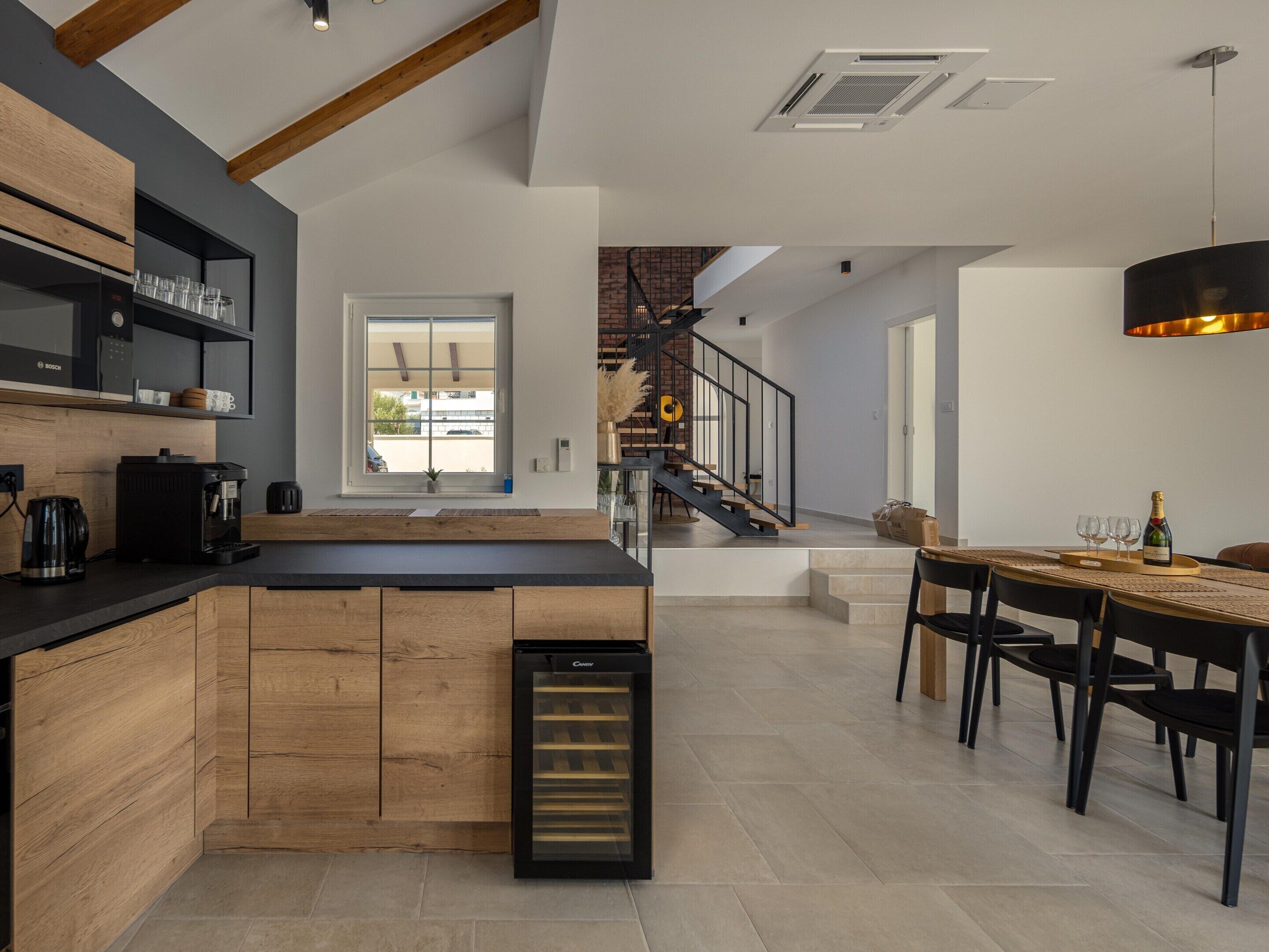 Villa | Private kitchen | Highchair, cleaning supplies