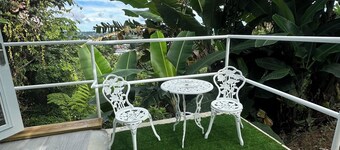 Peaceful cozy studio w a/c with breezy views, private patio & intimate space.