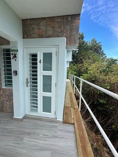 Peaceful cozy studio w a/c with breezy views, private patio & intimate space.