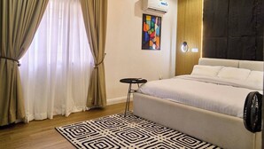 In-room safe, desk, laptop workspace, blackout drapes - Kair Serviced Apartment (Benin City)
