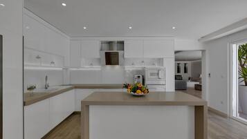 Villa | Private kitchen | High chair, cleaning supplies