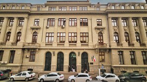 A large, classical building with multiple windows and a central entrance. -  Piata Romana Suites - Pumo Properties (Bucharest)