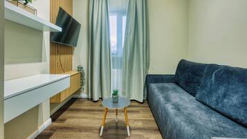 Deluxe-Apartment | Wohnzimmer | Flachbildfernseher