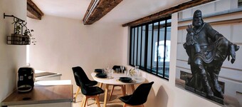 King- Elegant Minimalist Loft with Rustic Beams and Industrial Accents