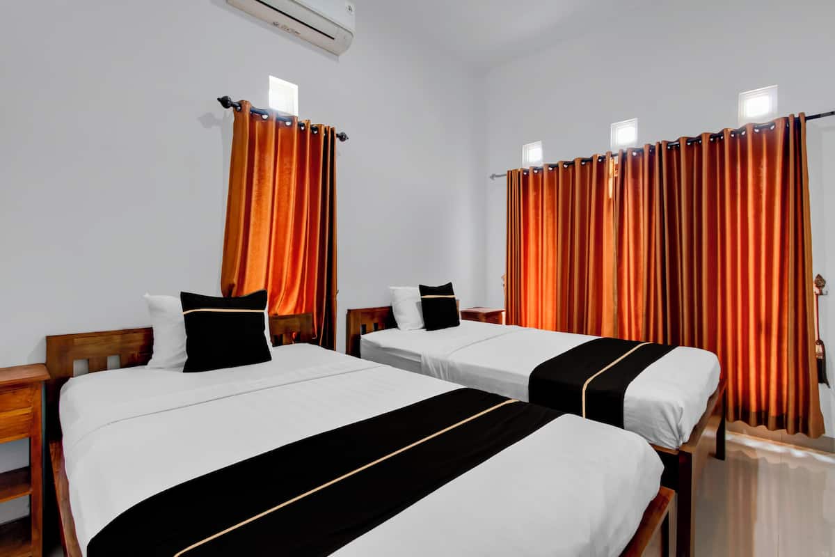 Habitación Deluxe con 2 camas individuales | Wifi gratis y ropa de cama