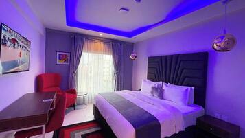 Deluxe Room, Balcony, City View | In-room safe, desk, laptop workspace, blackout drapes
