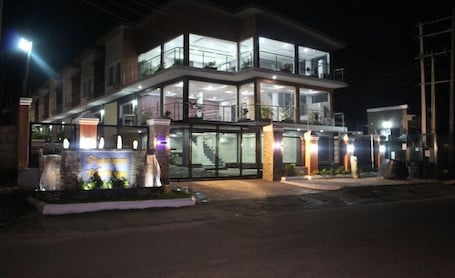 Front of property - evening/night. Blossom Heritage Hotel