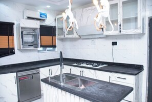 Economy Apartment, Balcony, City View | Private kitchen - Triple J's Apartment  (Benin City)