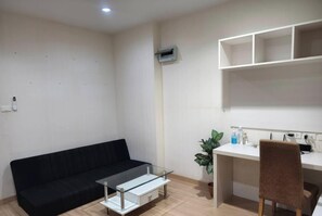 Interior - Fully furnished 1-bedroom condo with two air conditioning units in room. (Krung Thep Maha Nakhon)
