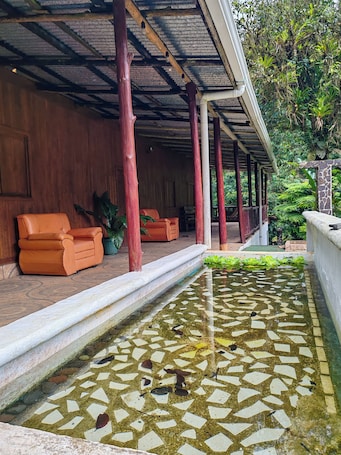 Terrace/patio. Finca El Descanso Costa Rica: Typical cottage for relaxation and families