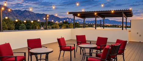 Rooftop deck seating at dusk