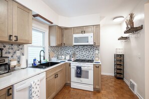 Fridge, microwave, oven, stovetop - Charming Renovated Home in Lakewood (Lakewood)