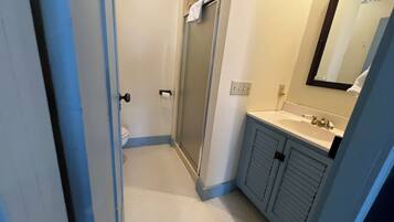 Shower, towels, soap, toilet paper