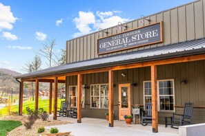 A building with a sign reading 'Tall Timber's General Store' and 'Timberline Coffeehouse.' - Private Hot Tub at The Bobber Stop, Arcade, Community Pools Nearby & Free Attraction Tickets (Hollister)