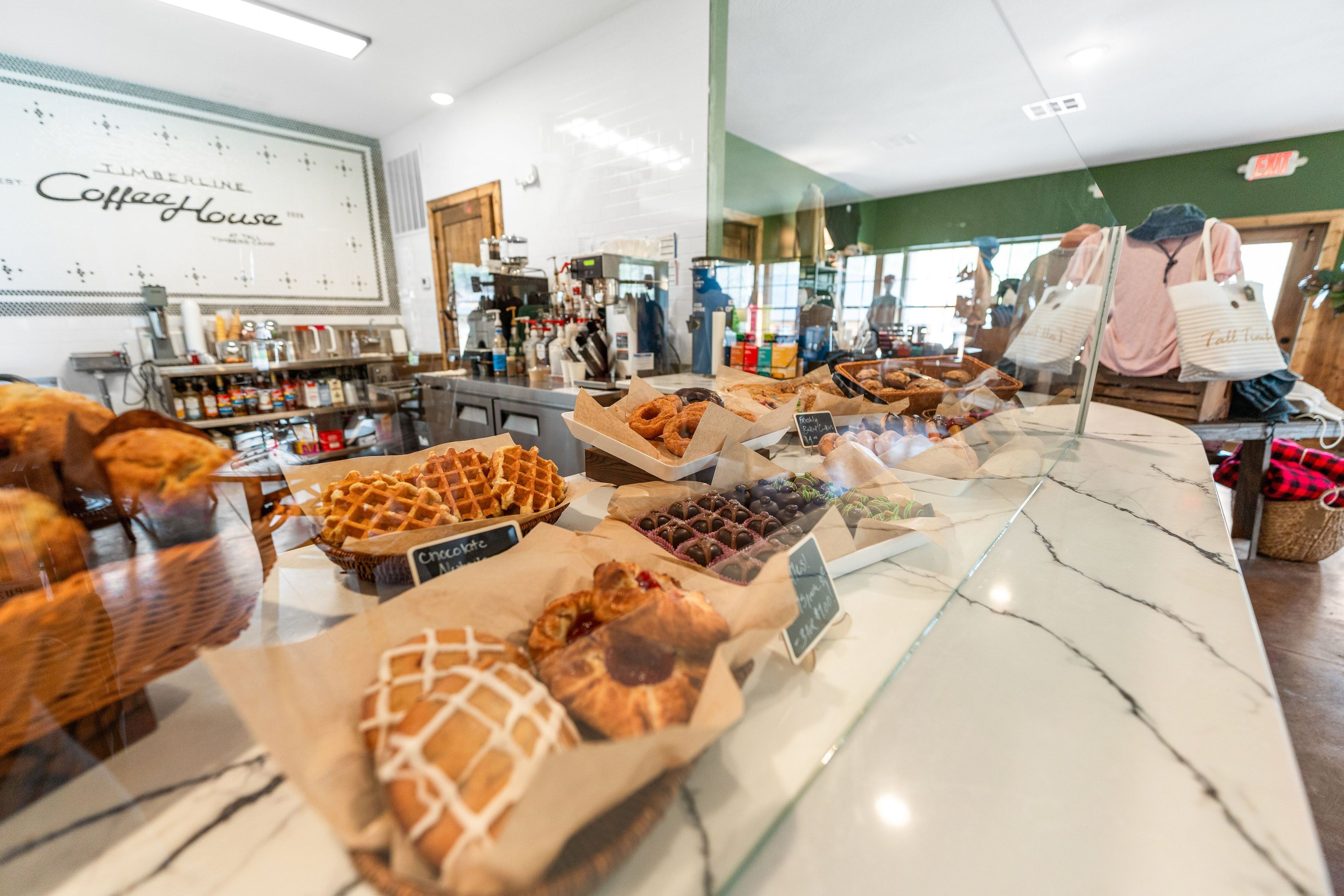A bakery display with various baked goods.