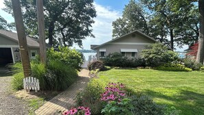 A residential area with a paved driveway leading to a house with a mailbox marked '31081'. - Magician Lakefront - 7 bedrooms, 4.5 baths, screened in porch and coffee bar. (Dowagiac)