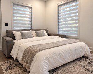 The premium queen size sleeper sofa opens into a comfortable second bed. - Forest Villa at Horizons Sandhills (Patrick)