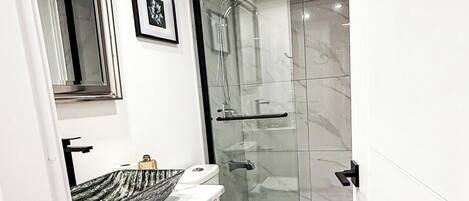 Shower, hair dryer, towels, soap