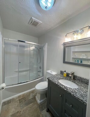 Shower, hair dryer, towels, soap