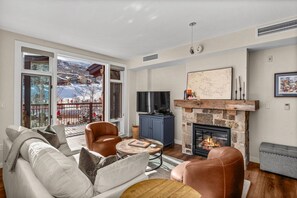 TV, fireplace - Sunny Mountain Retreat Near Gondola. Expansive Deck with Mountain Views & Air Conditioning! (Snowmass Village)
