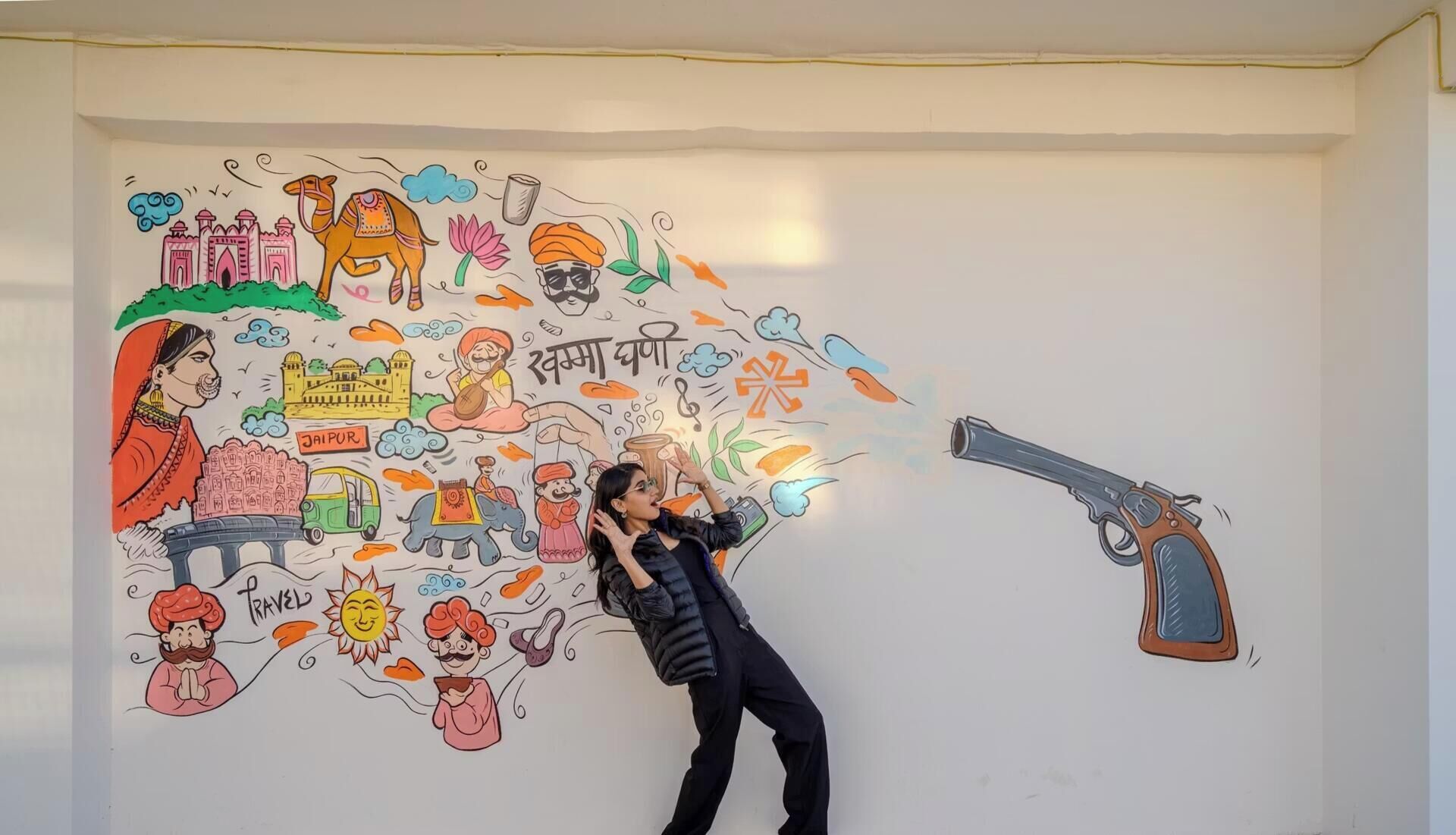 A mural with various cultural and travel-related illustrations.